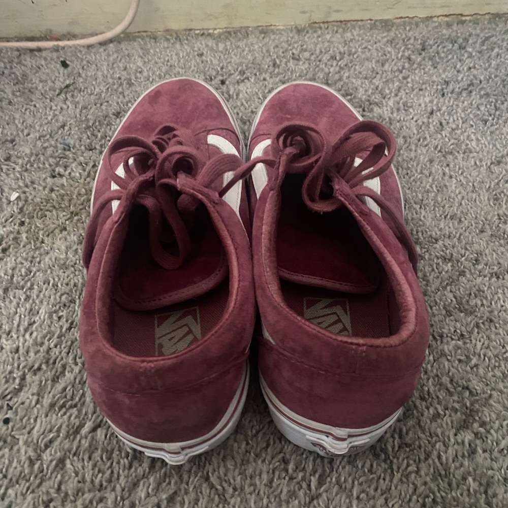 Burgundy vans.